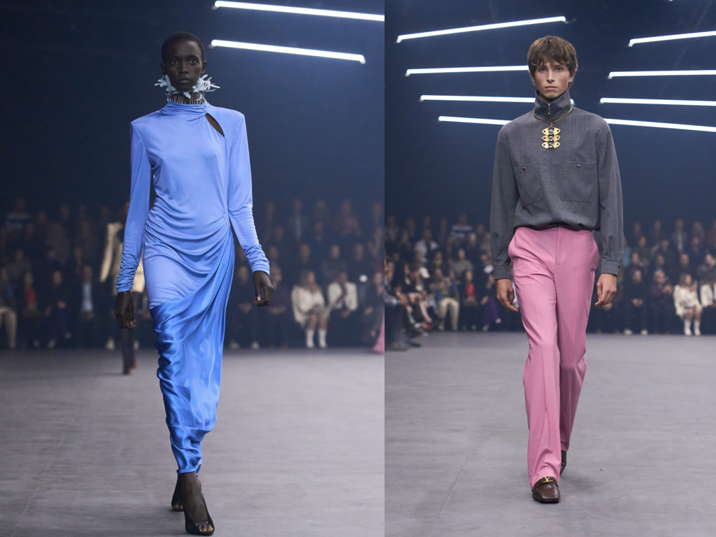 Valentino SS 2026: abito lungo blu drappeggiato e look maschile con camicia grigia e pantaloni rosa, tra eleganza fluida e contrasti cromatici.